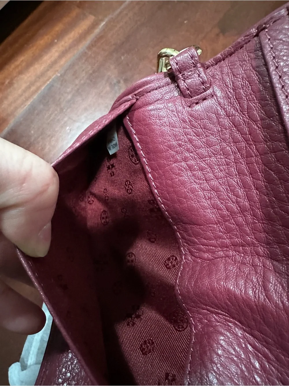 Tory Burch Pebbled Leather Wristlet in Deep Burgundy with Gold Logo